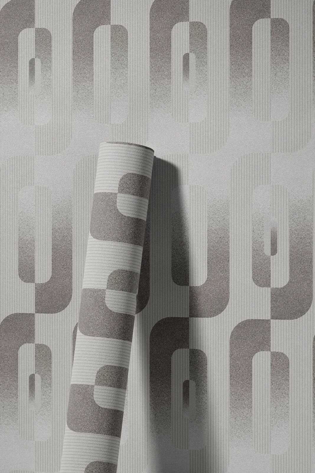             Grafik-Tapete mit Reto Muster in Grau und Silber
        