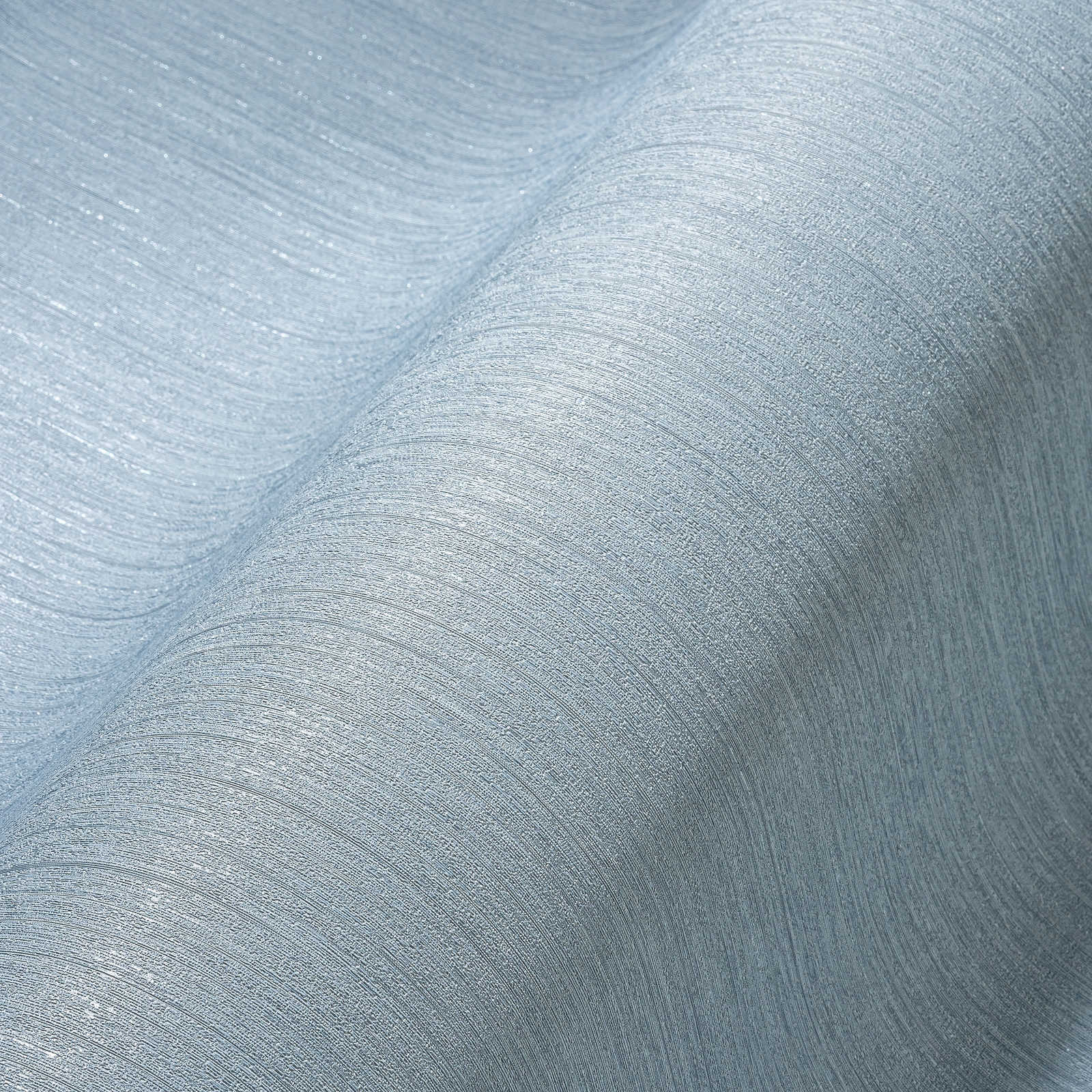             Blaue Vliestapete einfarbig, seidenmatt mit Struktureffekt
        
