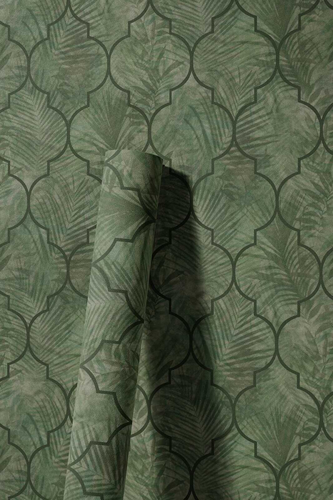             Vliestapete mit Blättermuster auf Fliesenoptik – Grün
        