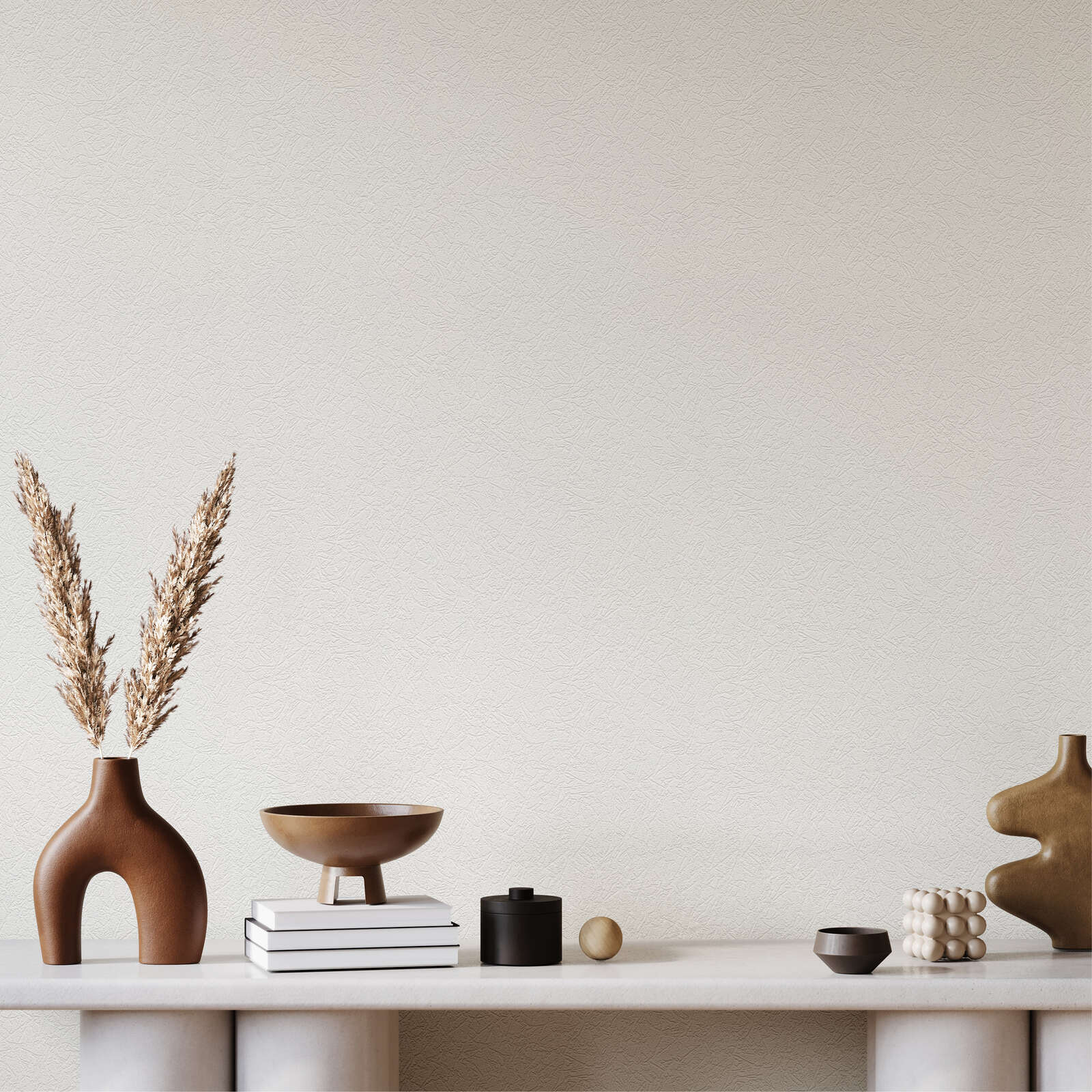             Überstreichbare Tapete mit Rauputzoptik
        