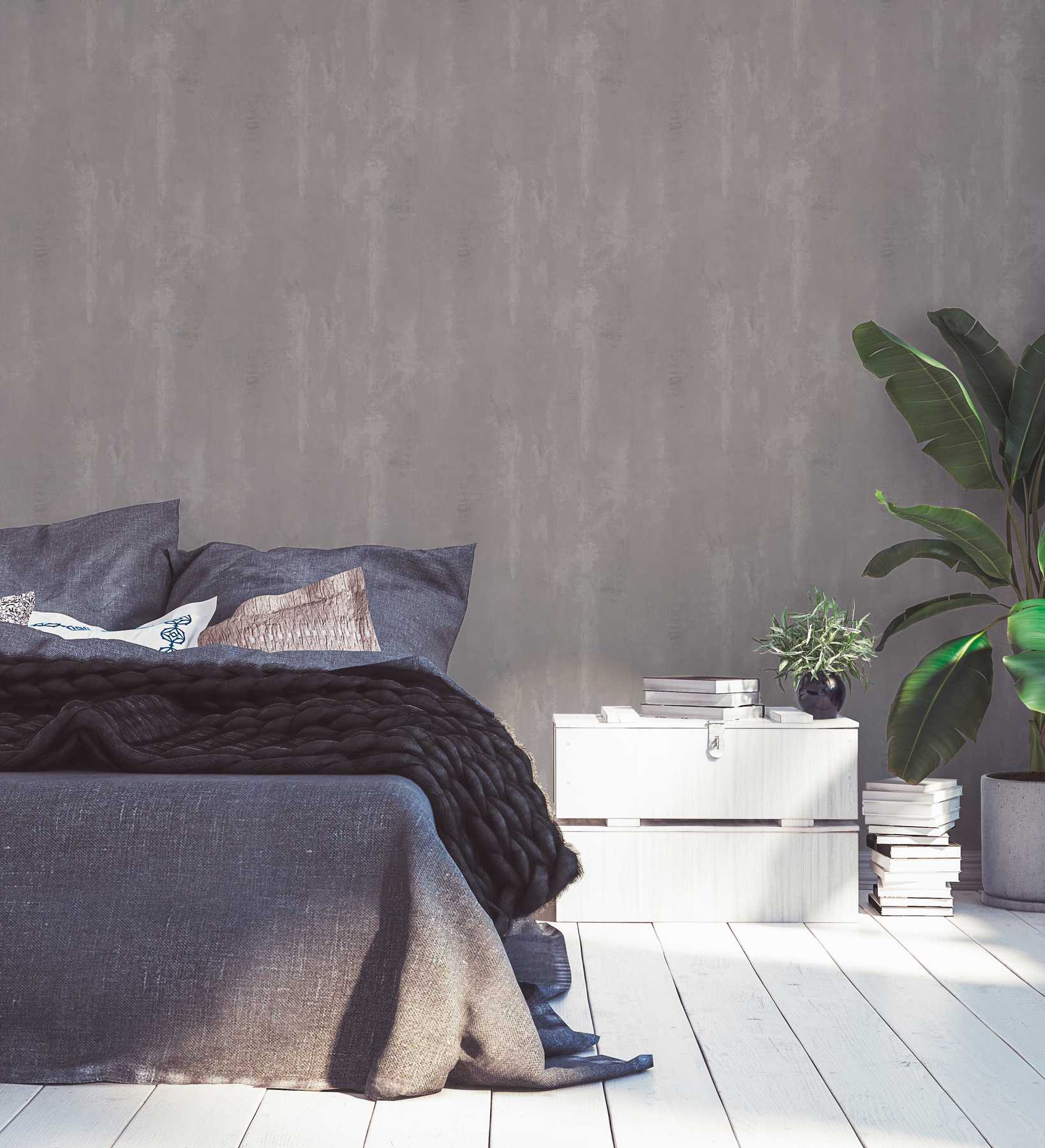             Vliestapete mit Wischbeton-Optik im Used Look – Grau
        