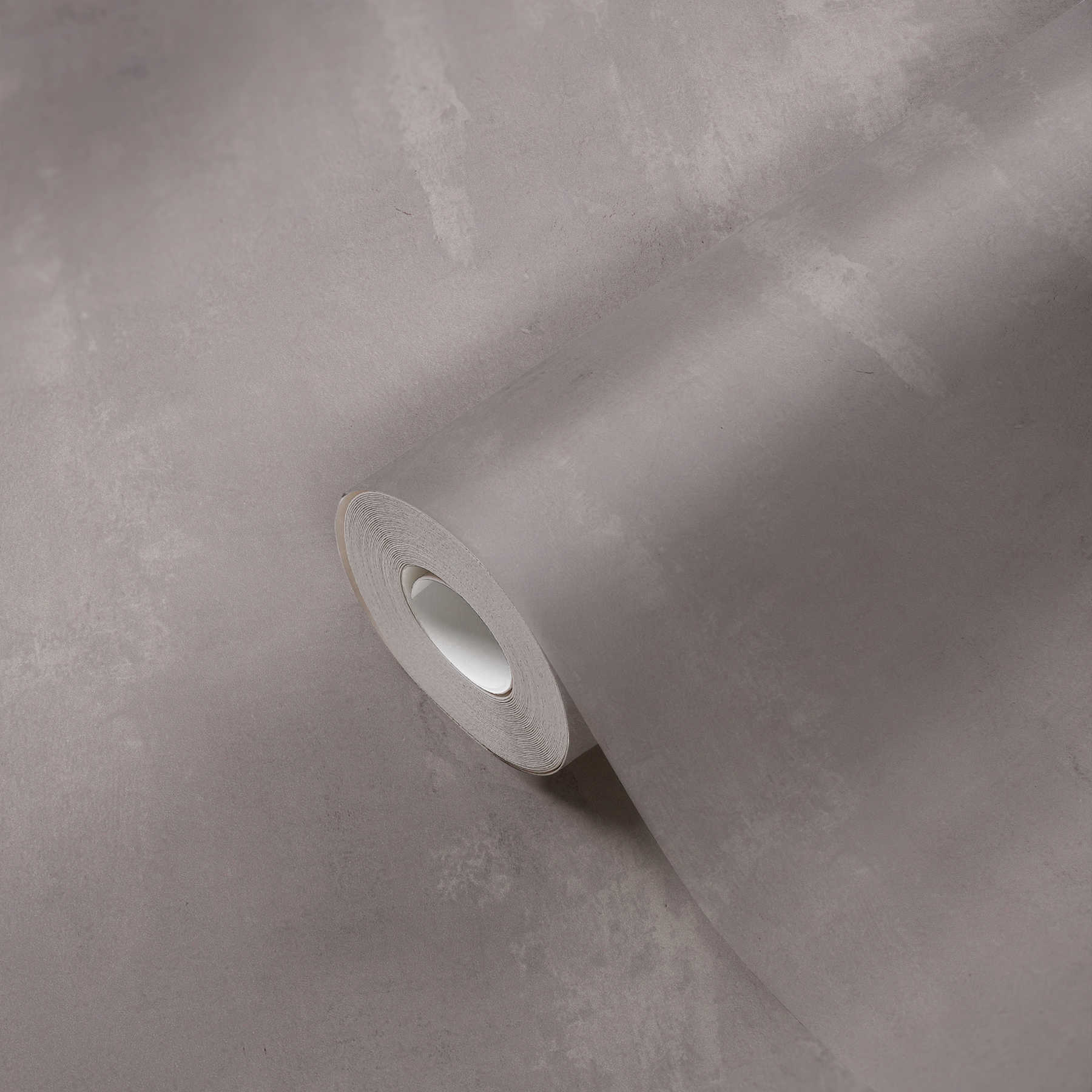             Vliestapete mit Wischbeton-Optik im Used Look – Grau
        