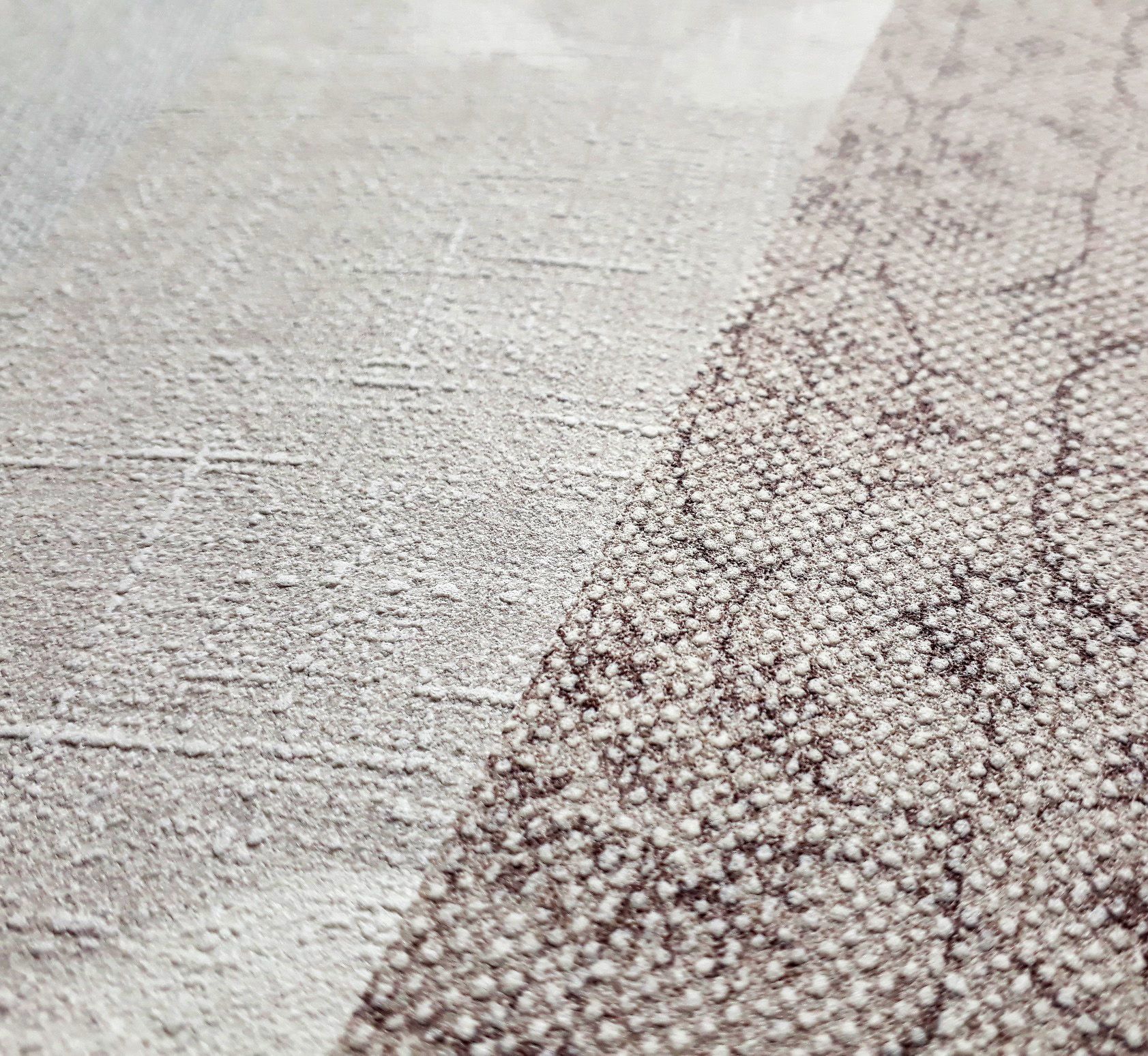 close-up of textured wallpaper with foamed surface texture