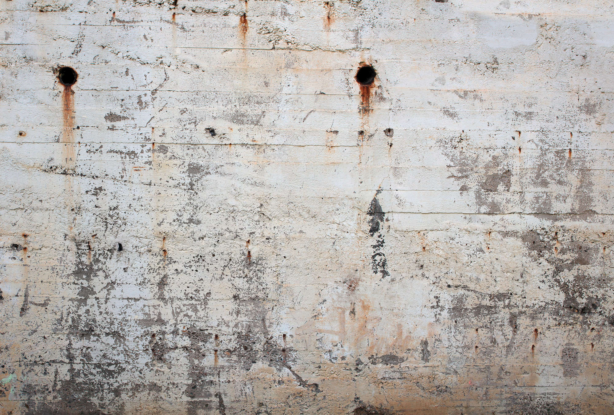 concrete wall, weathered surface, rust stains, crack lines, industrial wall