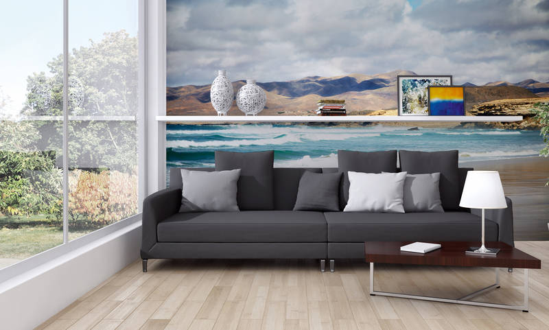             Fototapete Strandblick mit Gebirge im Hintergrund
        