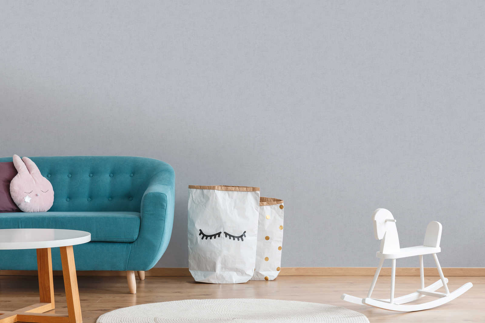             Melierte Tapete uni Grau mit Metallic Glanz
        