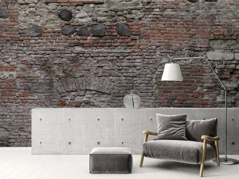 brick wall, concrete credenza, floor lamp, armchair, ottoman
