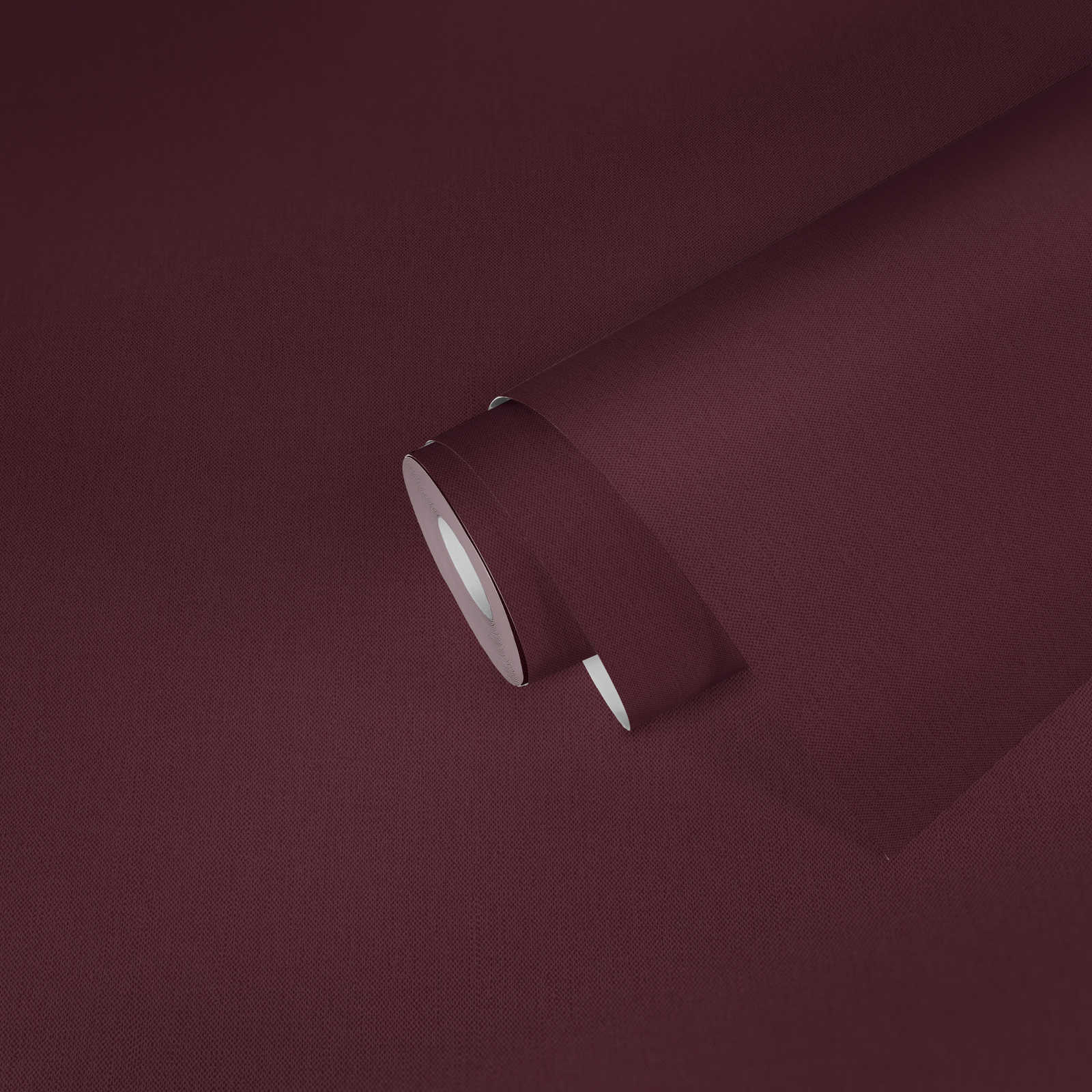             Bordeaux rote Tapete mit Textilstruktur Violett & Rot
        