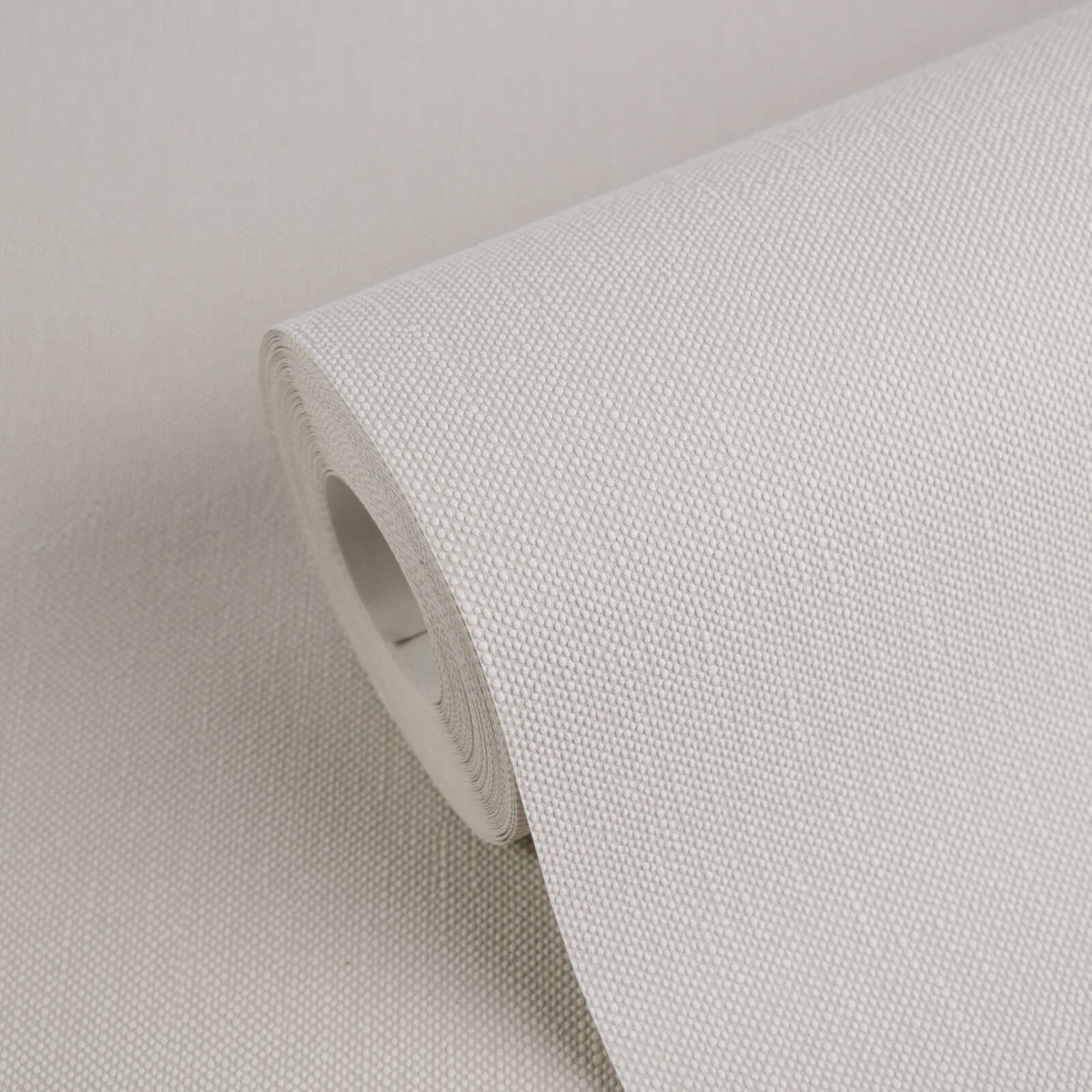 Einfarbige Vliestapete mit leichter Textilstruktur – Beige