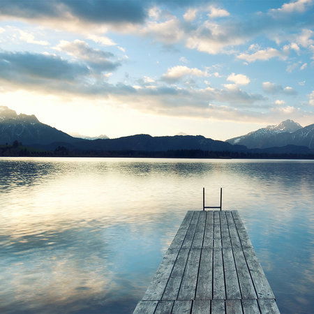         Mountain lake with water jetty and sunrise mural
    
