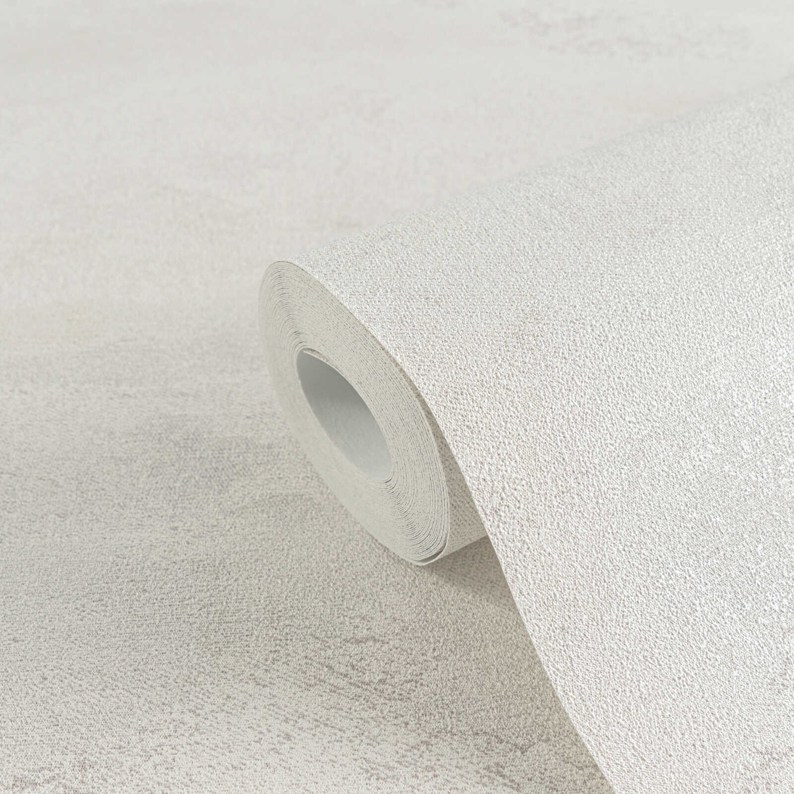             Exklusive Vliestapete mit strukturierter und schimmernder Wellenoptik – Weiß, Grau, Metallic
        