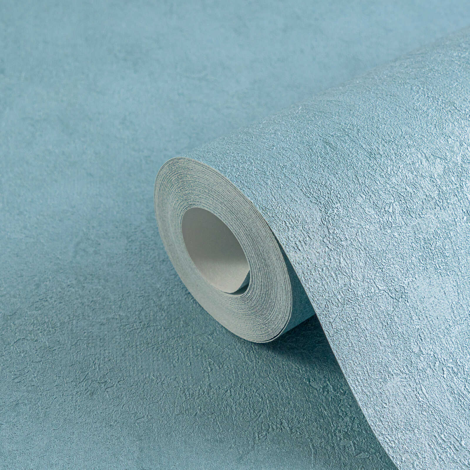         Sanfte Vliestapete mit feiner texturierter Oberfläche und Putzoptik – Blau, Metallic
    