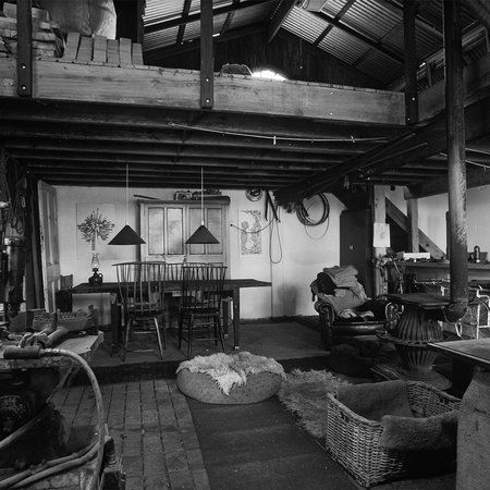         Muurschildering rustieke hut fotomotief zwart-wit
    