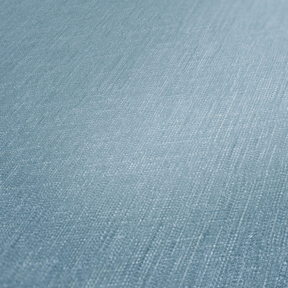             Vliestapete Blau meliert mit Textilstruktur im Bouclé Stil
        