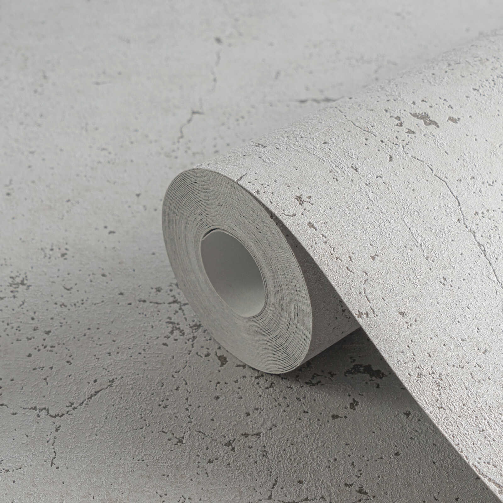             Behang met betonlook, optische barsten en poriën - Grijs
        