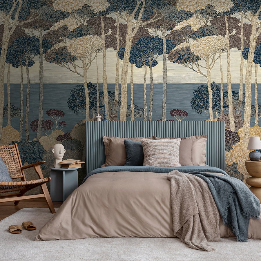 Decorative non-woven wallpaper with artistic forest panorama and tree design matt & smooth - blue
