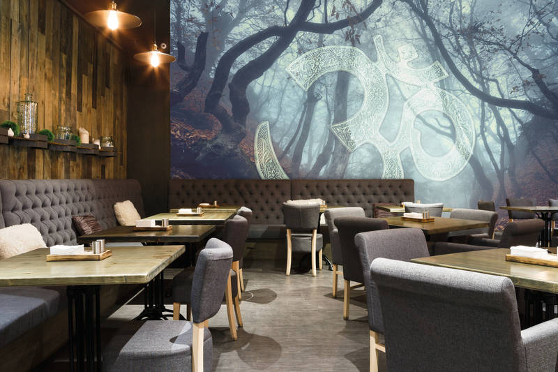             Ohm icon & leaf forest motif mural - blue, green, brown
        