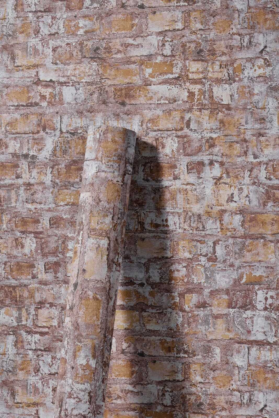             Vliesbehang in baksteenlook met muurmotief - grijs, bruin, wit, roest
        