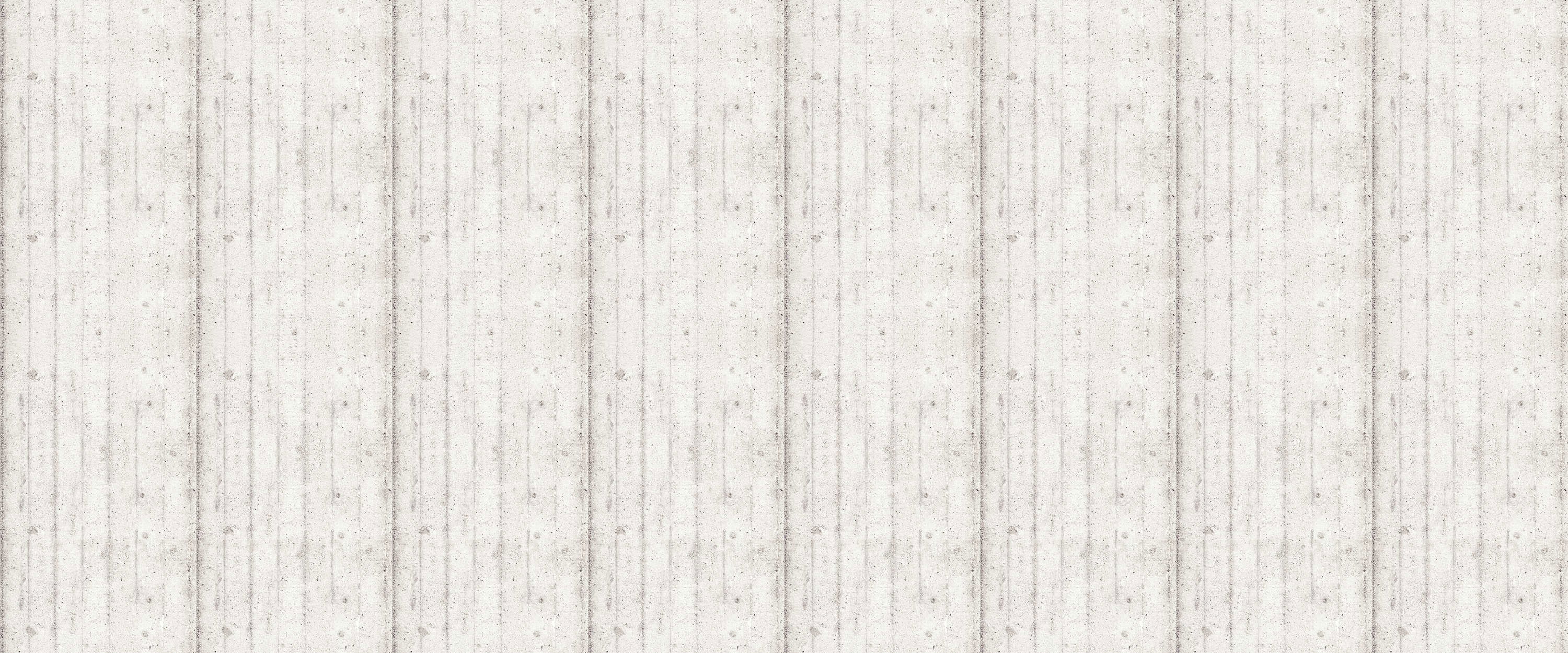             Fototapete mit Sichtbeton-Optik – offene Bretterschalung
        