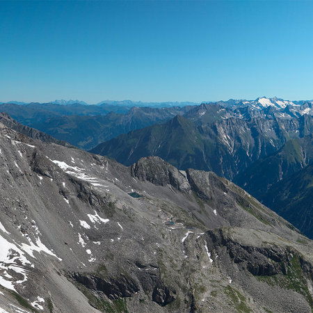         Panorama Fototapete mit zerklüftetem Alpengebirge
    