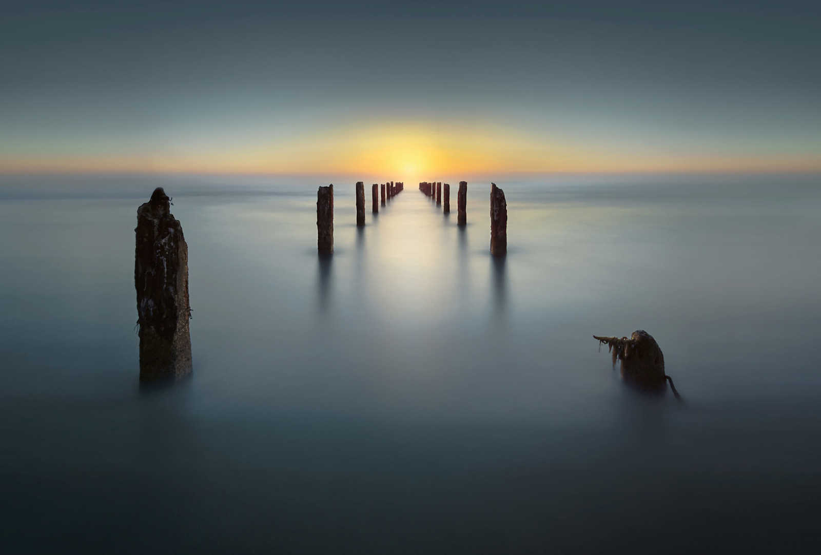         Photo wallpaper nature lake with old jetty - blue, yellow, brown
    